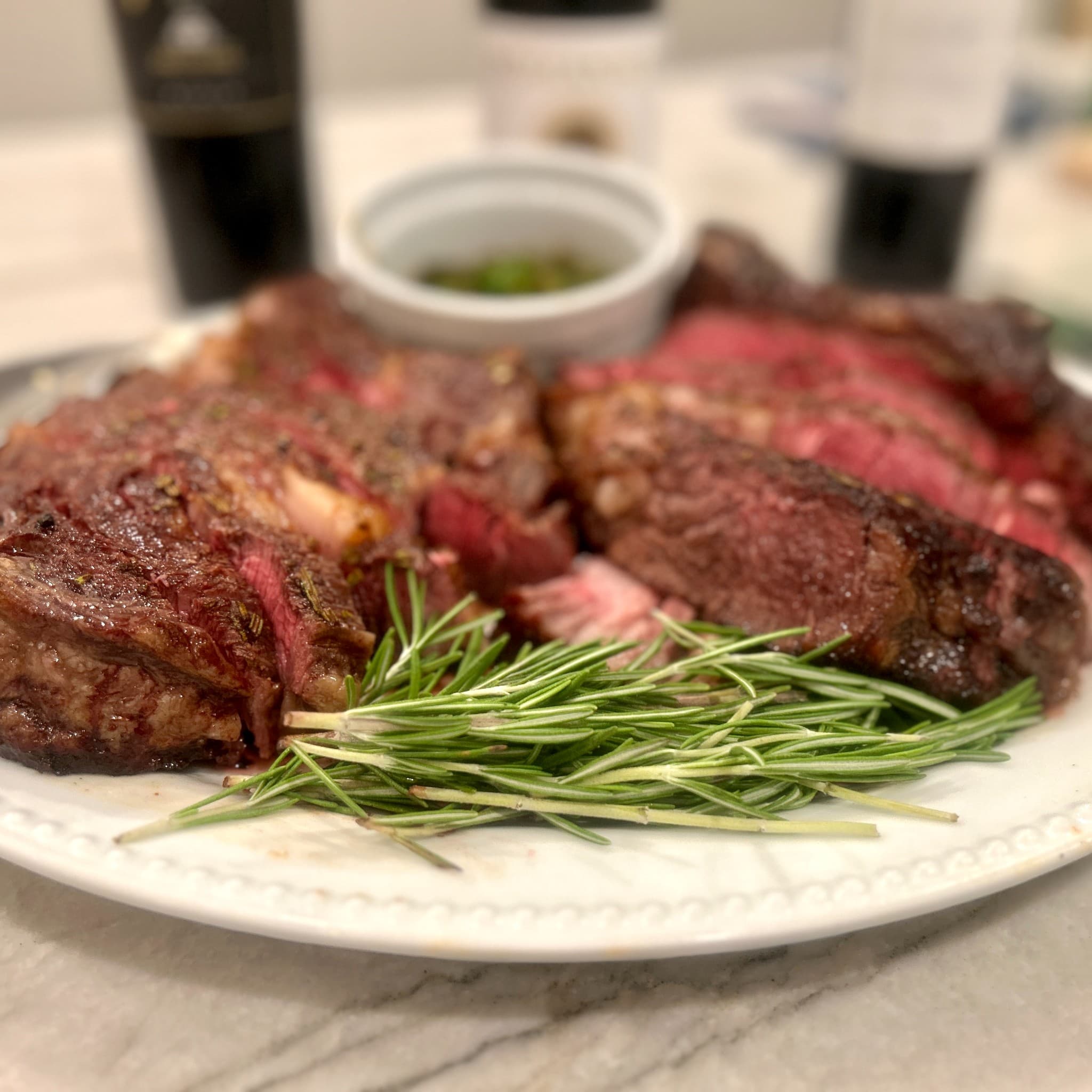 Sliced ribeye steak with rosemary